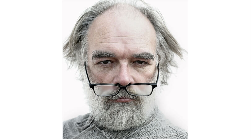 Old Man with eyeglasses down the brim of his nose